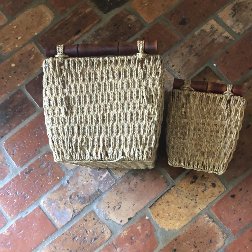 2 Wicker storage baskets with wooden handles